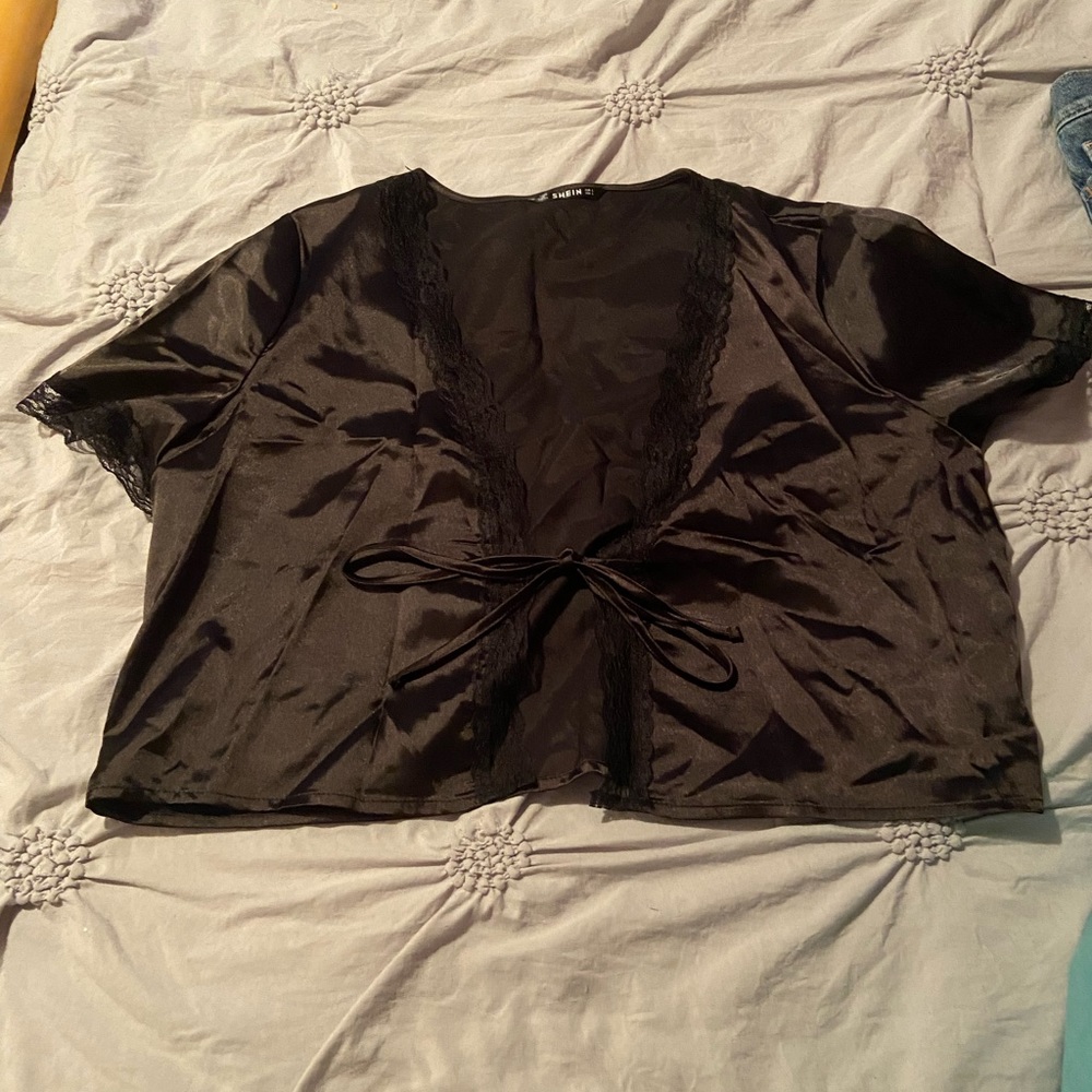 Black silk like top that ties in front